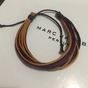 Multi-string adjustable bracelet